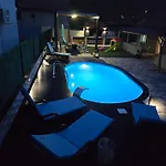 Grey House With Heated Pool Drnis Holiday home *
