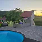 Grey House With Heated Pool Drnis Holiday home *
