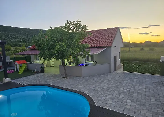 Grey House With Heated Pool Drnis Holiday home *